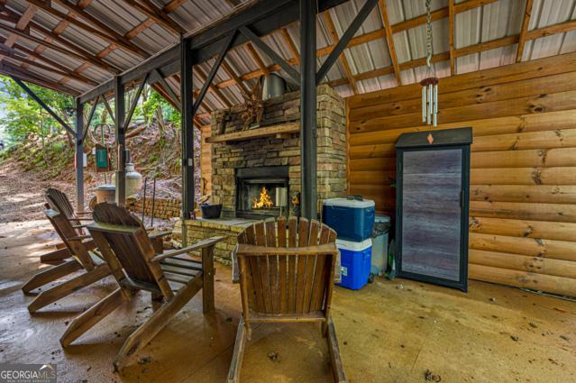 44 11th St, Ellijay, GA 30540 - view of patio / terrace featuring an outdoor stone fireplace