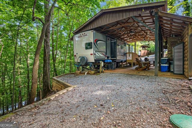 44 11th St, Ellijay, GA 30540 - exterior space with a detached carport and gravel driveway
