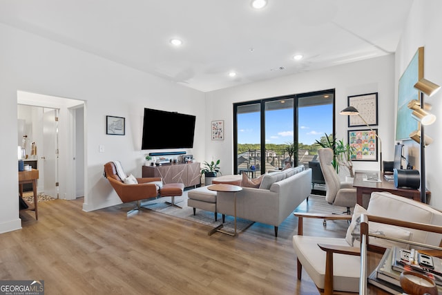 112 Rogers St NE Unit 410, Atlanta, GA 30317 - living area featuring light wood-type flooring, recessed lighting, and baseboards