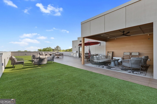 112 Rogers St NE Unit 410, Atlanta, GA 30317 - view of green lawn featuring an outdoor living space, ceiling fan, a patio, and outdoor dining area
