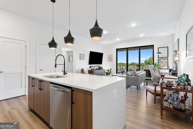 112 Rogers St NE Unit 410, Atlanta, GA 30317 - kitchen featuring stainless steel dishwasher, a sink, light countertops, open floor plan, and modern cabinets