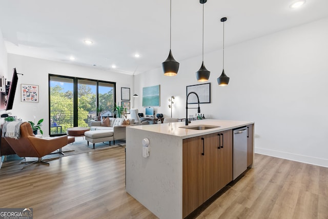 112 Rogers St NE Unit 410, Atlanta, GA 30317 - kitchen featuring a sink, dishwasher, open floor plan, light wood finished floors, and recessed lighting