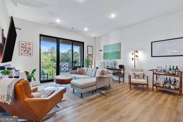 112 Rogers St NE Unit 410, Atlanta, GA 30317 - living room featuring baseboards, light wood-style floors, and recessed lighting
