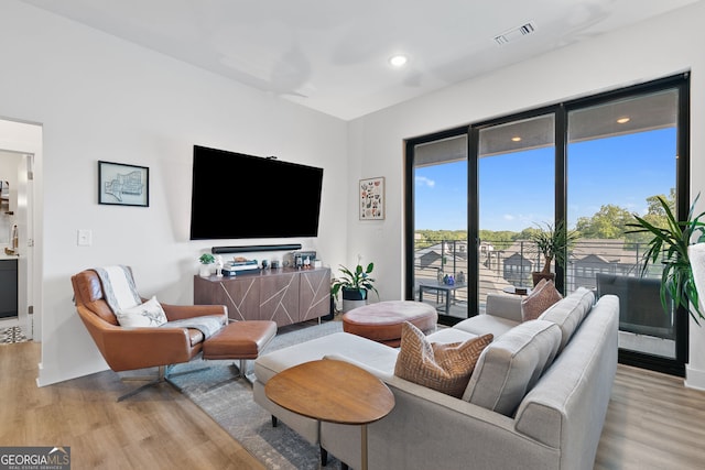 112 Rogers St NE Unit 410, Atlanta, GA 30317 - living room featuring light wood finished floors and recessed lighting