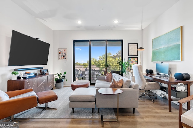 112 Rogers St NE Unit 410, Atlanta, GA 30317 - living area featuring wood finished floors, a desk, recessed lighting, and baseboards