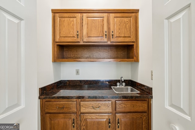 51 Ivy Chase NE, Atlanta, GA 30342 - kitchen with open shelves, brown cabinets, and dark stone countertops