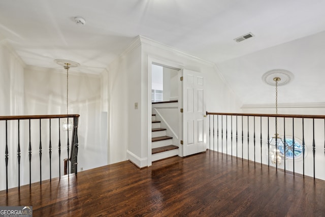 51 Ivy Chase NE, Atlanta, GA 30342 - hall featuring wood finished floors, vaulted ceiling, and crown molding