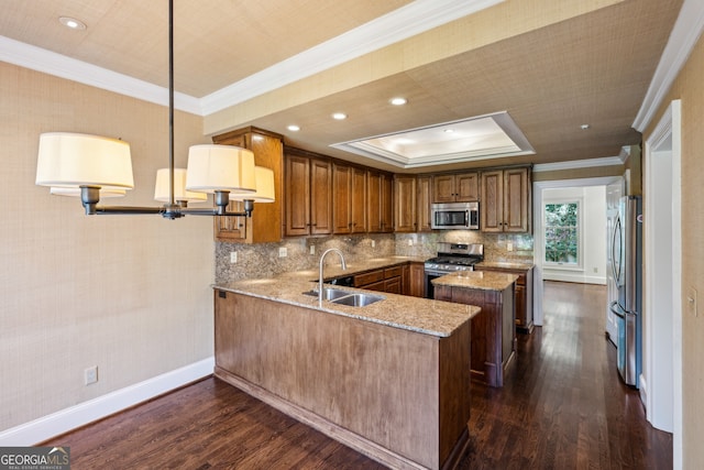51 Ivy Chase NE, Atlanta, GA 30342 - kitchen with appliances with stainless steel finishes, dark wood-style floors, brown cabinetry, ornamental molding, and light stone counters