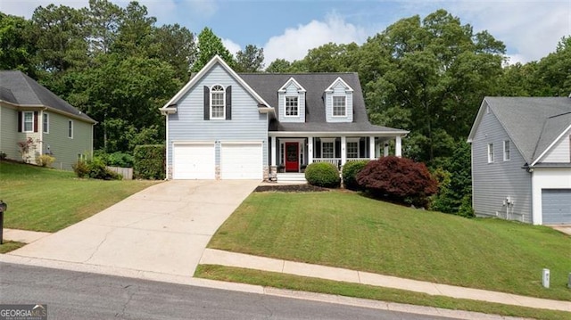 118 Valleyside Dr, Dallas, GA 30157 - view of front of home with covered porch, concrete driveway, a front yard, and a garage