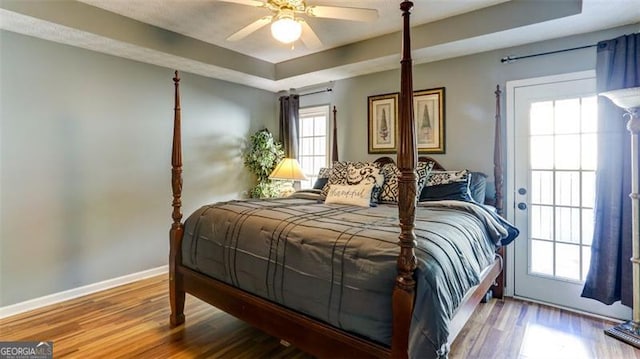 118 Valleyside Dr, Dallas, GA 30157 - bedroom with a tray ceiling, wood finished floors, baseboards, and a ceiling fan