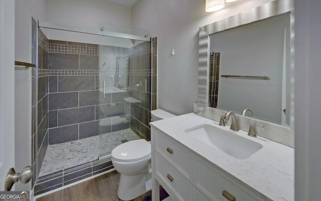 276 E Tugalo St, Toccoa, GA 30577 - full bathroom featuring a stall shower, vanity, and wood finished floors