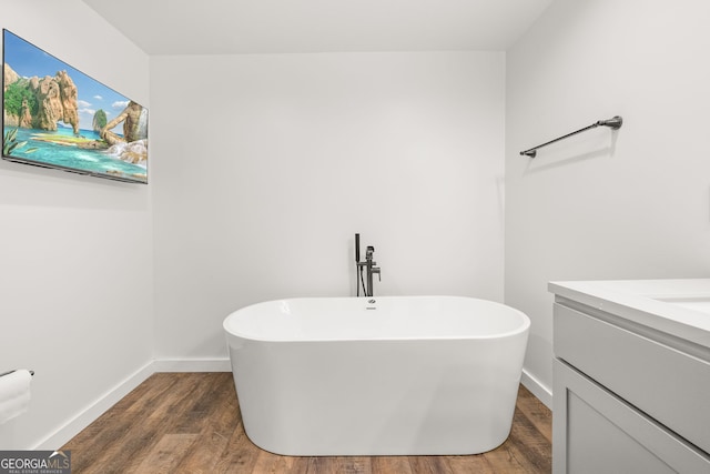 1935 Sam Bell Rd, Clarkesville, GA 30523 - full bathroom with a freestanding tub, wood finished floors, and vanity