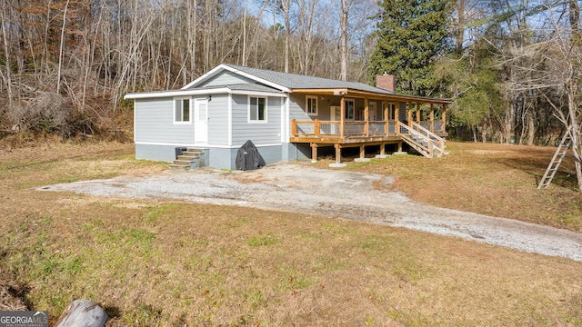 1935 Sam Bell Rd, Clarkesville, GA 30523 - view of front of property featuring a front yard, covered porch, and a chimney