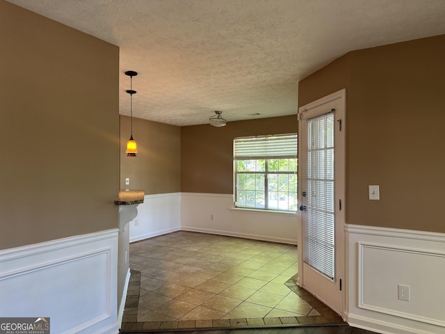 1280 Waterwood Dr, Loganville, GA 30052 - unfurnished room featuring wainscoting and a textured ceiling
