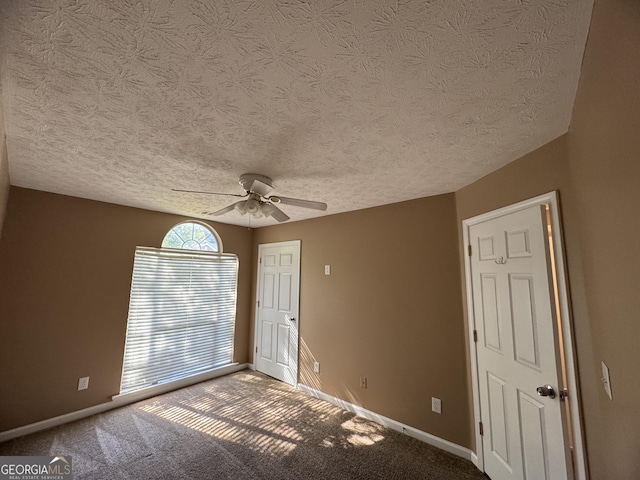 1280 Waterwood Dr, Loganville, GA 30052 - carpeted empty room featuring ceiling fan, baseboards, and a textured ceiling
