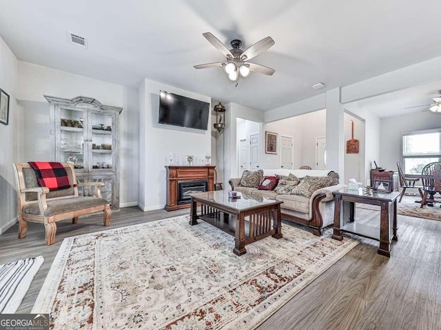 3931 Upper Bethany Rd, Ball Ground, GA 30107 - living room with a ceiling fan, wood finished floors, baseboards, and a fireplace