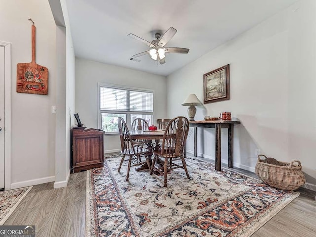 3931 Upper Bethany Rd, Ball Ground, GA 30107 - dining area featuring a ceiling fan, baseboards, and light wood-type flooring