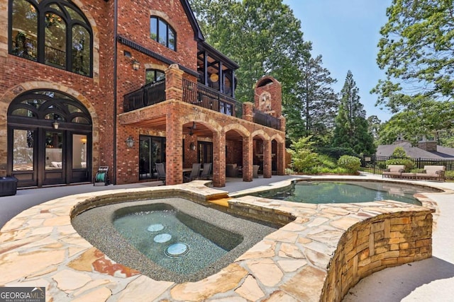 6678 Gaines Ferry Rd, Flowery Branch, GA 30542 - swimming pool featuring an in-ground hot tub, french doors, and a patio