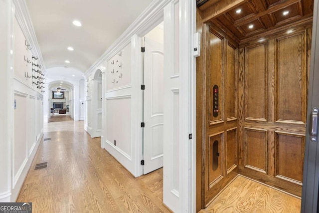 6678 Gaines Ferry Rd, Flowery Branch, GA 30542 - corridor featuring elevator, arched walkways, light wood-style flooring, vaulted ceiling, and ornate columns