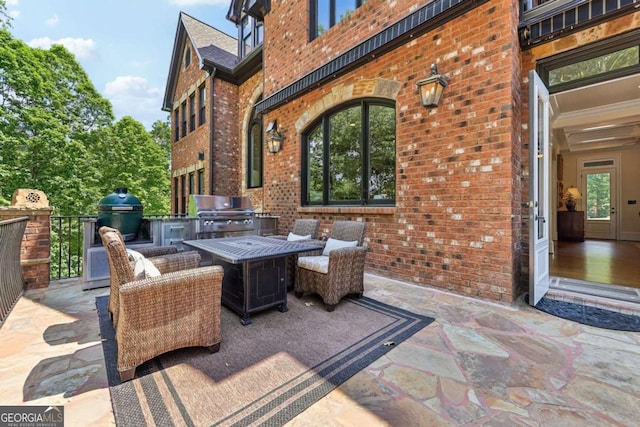 6678 Gaines Ferry Rd, Flowery Branch, GA 30542 - view of patio featuring an outdoor kitchen and outdoor dining area