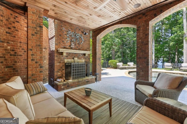 6678 Gaines Ferry Rd, Flowery Branch, GA 30542 - view of patio / terrace featuring an outdoor living space with a fireplace
