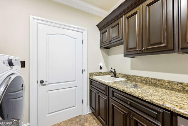 6678 Gaines Ferry Rd, Flowery Branch, GA 30542 - laundry area featuring washer / dryer, cabinet space, and crown molding