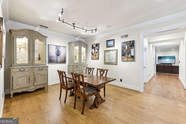 6678 Gaines Ferry Rd, Flowery Branch, GA 30542 - dining space featuring crown molding and light wood-type flooring