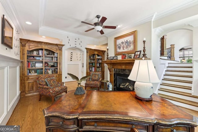 6678 Gaines Ferry Rd, Flowery Branch, GA 30542 - home office with a premium fireplace, ceiling fan, wood finished floors, ornamental molding, and recessed lighting