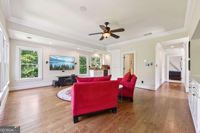 6678 Gaines Ferry Rd, Flowery Branch, GA 30542 - living area with wood finished floors, a ceiling fan, ornamental molding, and recessed lighting