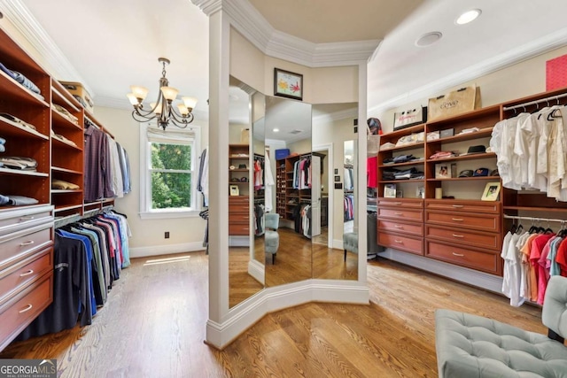 6678 Gaines Ferry Rd, Flowery Branch, GA 30542 - spacious closet featuring a chandelier and light wood-style flooring