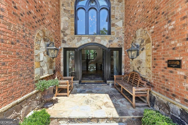 6678 Gaines Ferry Rd, Flowery Branch, GA 30542 - doorway to property featuring stone siding and brick siding