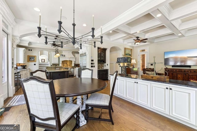 6678 Gaines Ferry Rd, Flowery Branch, GA 30542 - dining room with arched walkways, a ceiling fan, beam ceiling, wood finished floors, and coffered ceiling