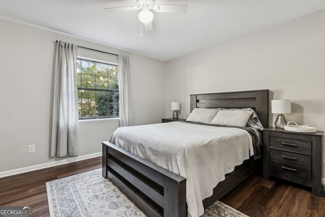 400 Dandy St, Saint Marys, GA 31558 - bedroom with dark wood-type flooring, baseboards, a ceiling fan, and a textured ceiling
