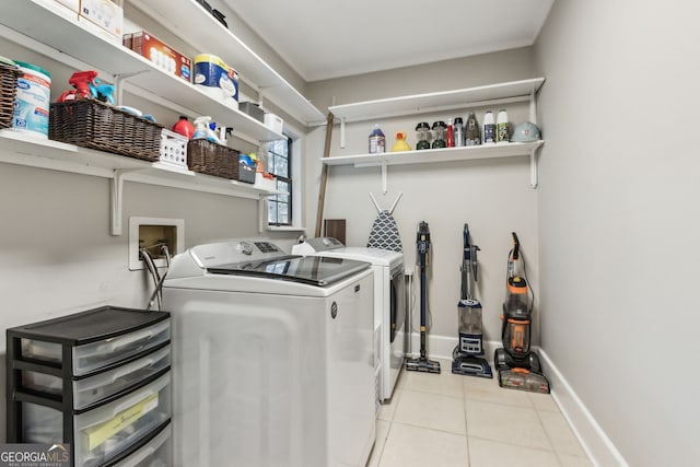 400 Dandy St, Saint Marys, GA 31558 - laundry room with washing machine and dryer, tile patterned floors, and baseboards