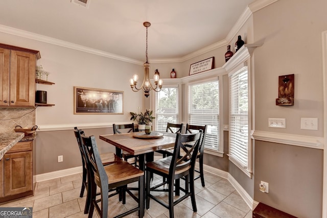 2469 Martini Way, Bethlehem, GA 30620 - dining space featuring light tile patterned floors, a chandelier, baseboards, and ornamental molding