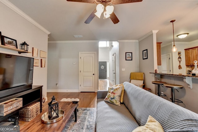 2469 Martini Way, Bethlehem, GA 30620 - living room with wood finished floors, ceiling fan, ornamental molding, and baseboards