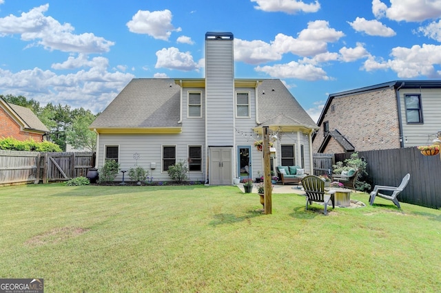2469 Martini Way, Bethlehem, GA 30620 - back of house with an outdoor living space, a chimney, a patio area, and a gate