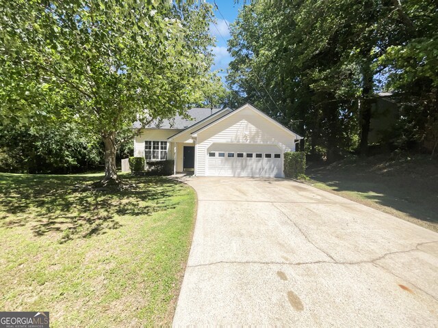 1503 Colt Ridge Ln SE, Mableton, GA 30126 - ranch-style home featuring a garage, concrete driveway, and a front lawn