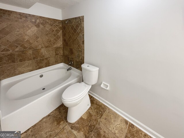 1503 Colt Ridge Ln SE, Mableton, GA 30126 - bathroom with stone tile flooring, double vanity, baseboards, and toilet