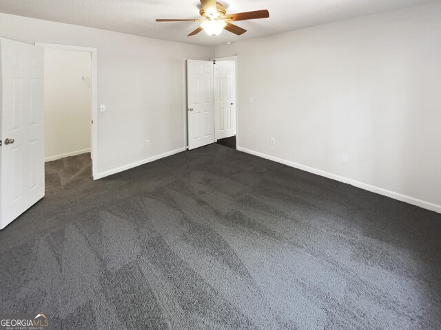 1503 Colt Ridge Ln SE, Mableton, GA 30126 - unfurnished room with a ceiling fan, baseboards, and dark colored carpet