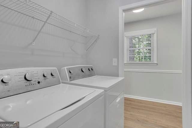 4516 Creekwood Cir NW, Kennesaw, GA 30152 - laundry area featuring independent washer and dryer, light wood-type flooring, and baseboards
