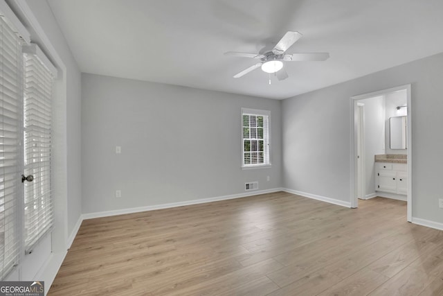 4516 Creekwood Cir NW, Kennesaw, GA 30152 - unfurnished bedroom with light wood-style floors, baseboards, ceiling fan, and ensuite bathroom