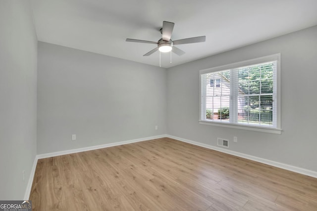 4516 Creekwood Cir NW, Kennesaw, GA 30152 - unfurnished room featuring light wood-style floors, baseboards, and a ceiling fan