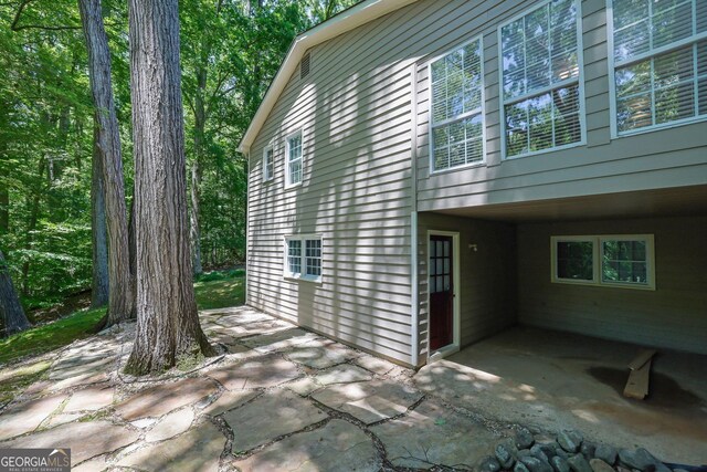 4516 Creekwood Cir NW, Kennesaw, GA 30152 - view of side of property featuring a patio area