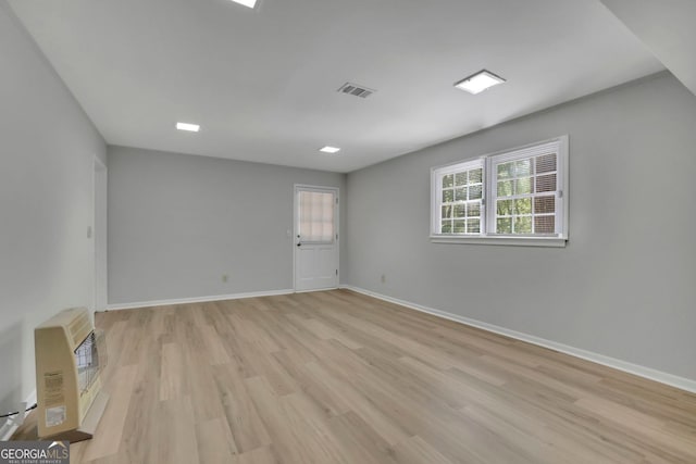 4516 Creekwood Cir NW, Kennesaw, GA 30152 - empty room with light wood finished floors, heating unit, and baseboards