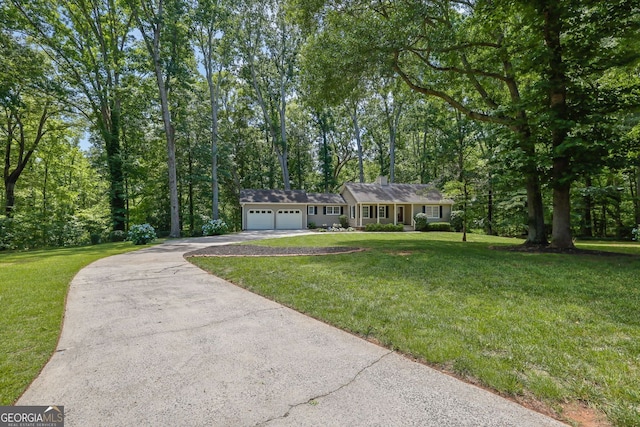 4516 Creekwood Cir NW, Kennesaw, GA 30152 - view of front of home featuring driveway, a garage, and a front yard