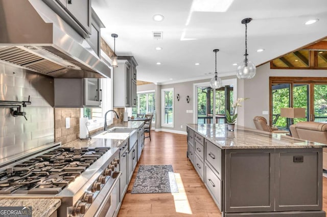 117 Valley View Ct, Blairsville, GA 30512 - kitchen with extractor fan, stainless steel gas range, gray cabinetry, light wood finished floors, and a sink