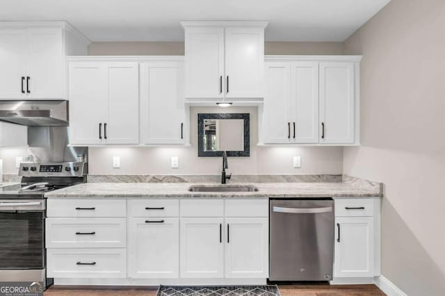 117 Valley View Ct, Blairsville, GA 30512 - kitchen with stainless steel appliances, extractor fan, a sink, white cabinets, and light stone countertops