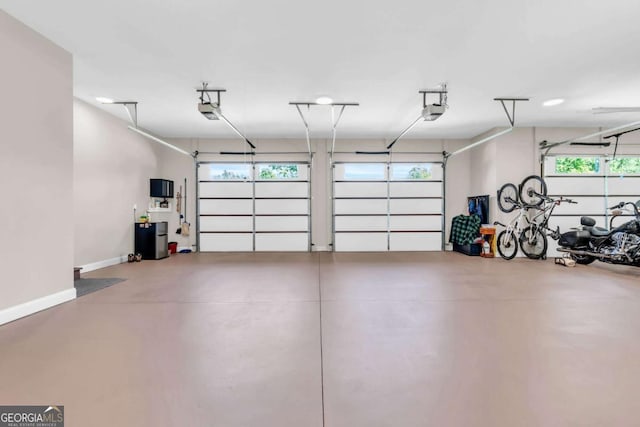 117 Valley View Ct, Blairsville, GA 30512 - garage with a garage door opener and baseboards
