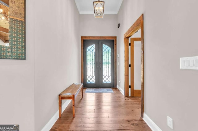 117 Valley View Ct, Blairsville, GA 30512 - entrance foyer featuring french doors, baseboards, wood-type flooring, crown molding, and a high ceiling